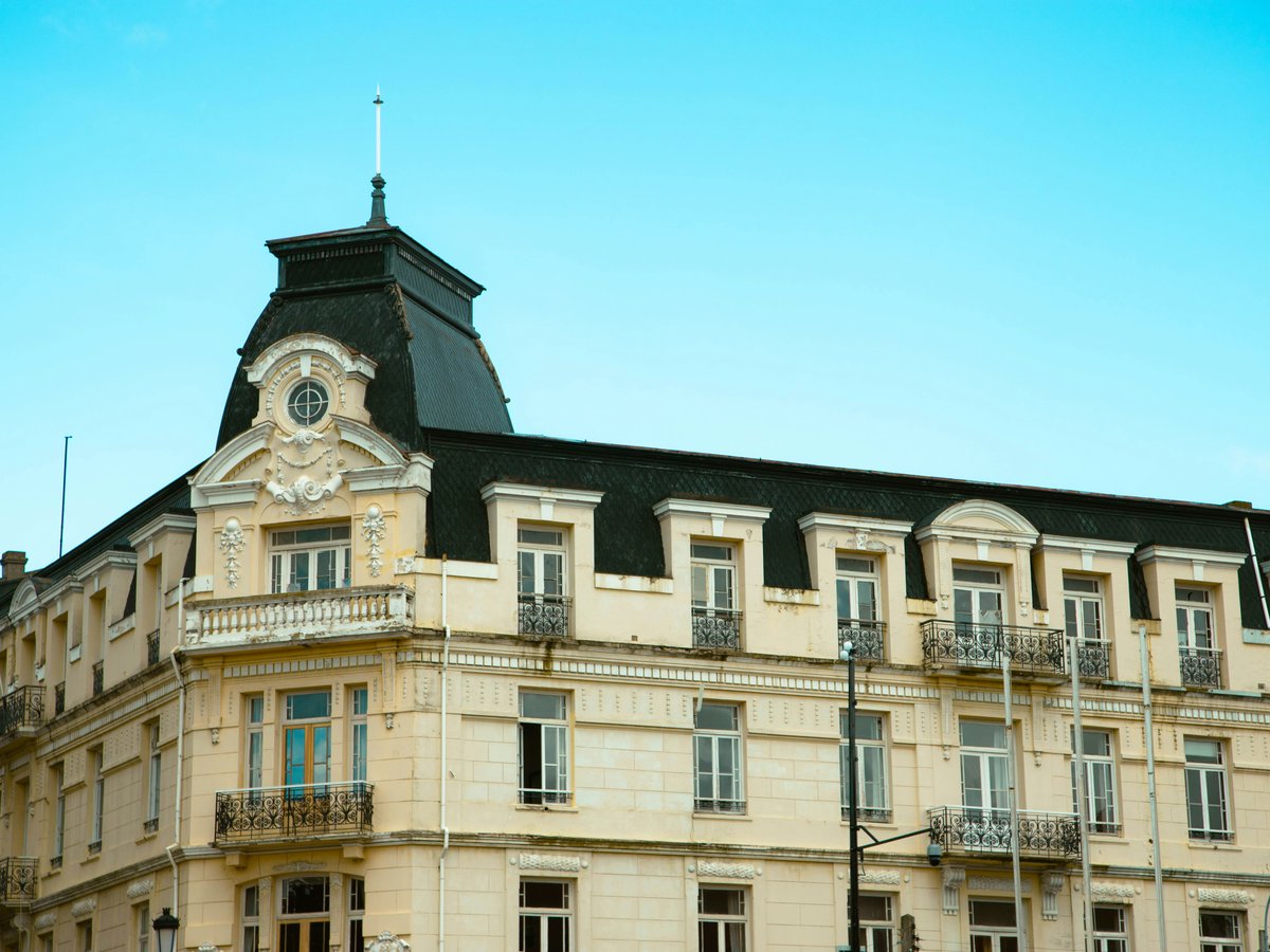 A large building with a clock on the top of it