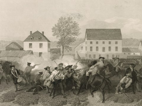 Revolutionary war soldiers in battle near buildings