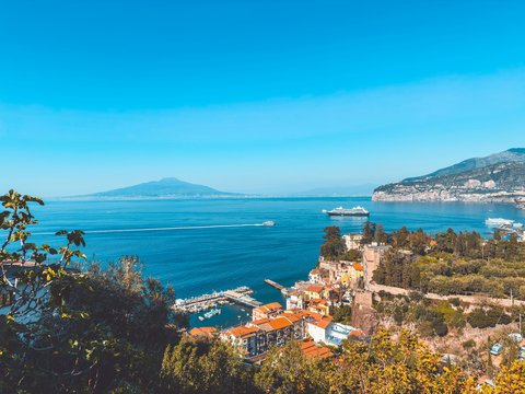 A scenic view of the ocean and mountains