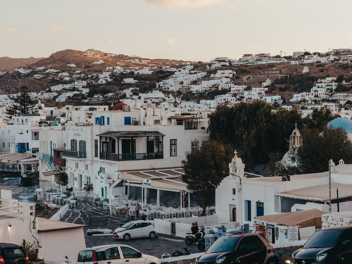Whitewashed buildings on a hillside overlooking the sea.