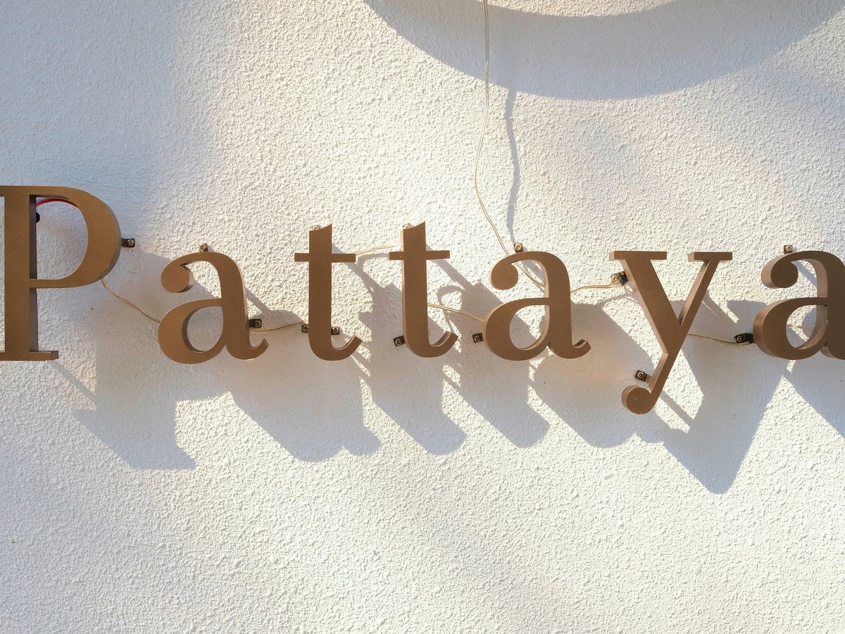 a sign that reads pataya on the side of a building