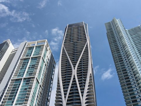 a couple of tall buildings sitting next to each other