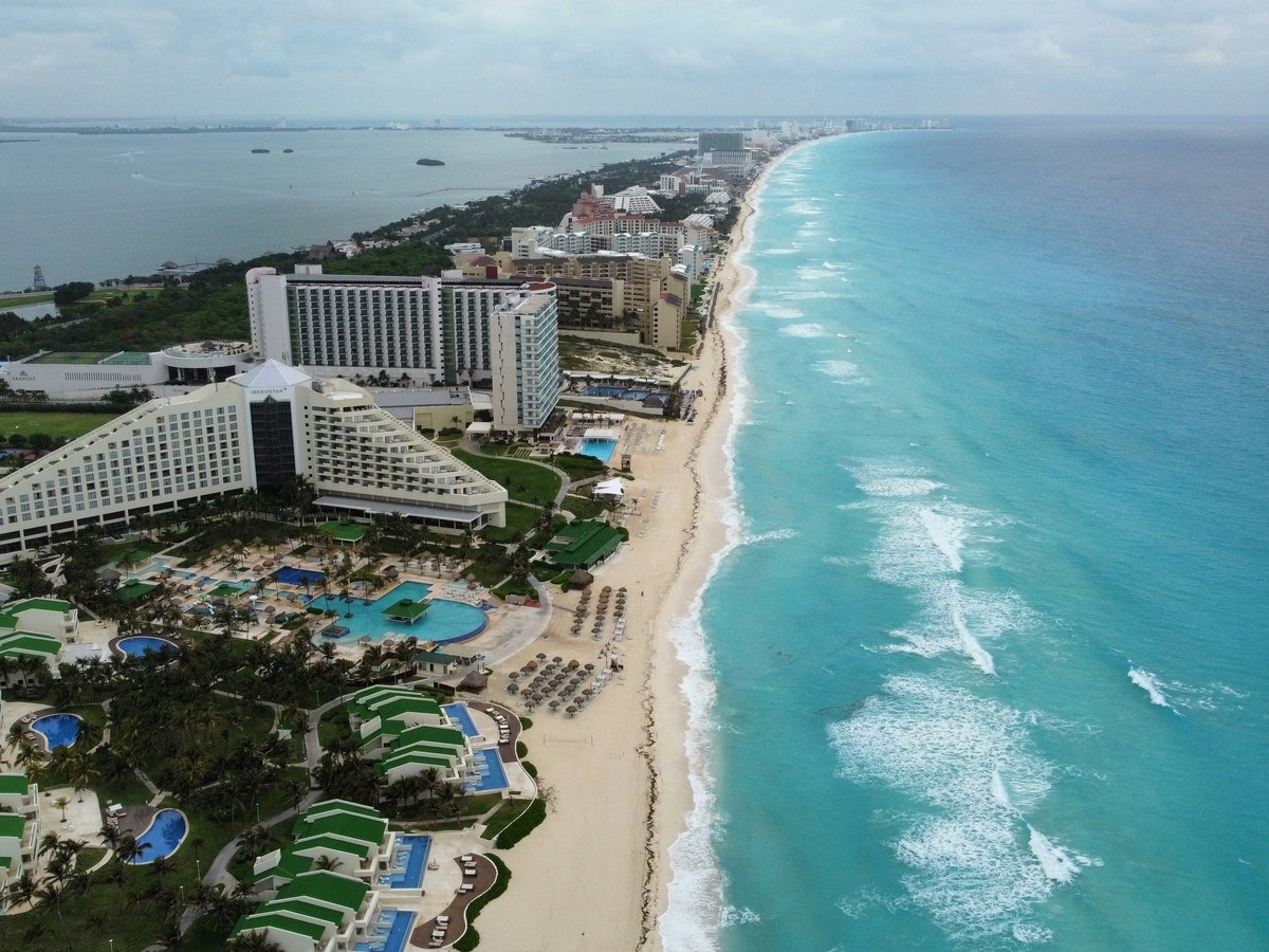 an aerial view of a resort and beach