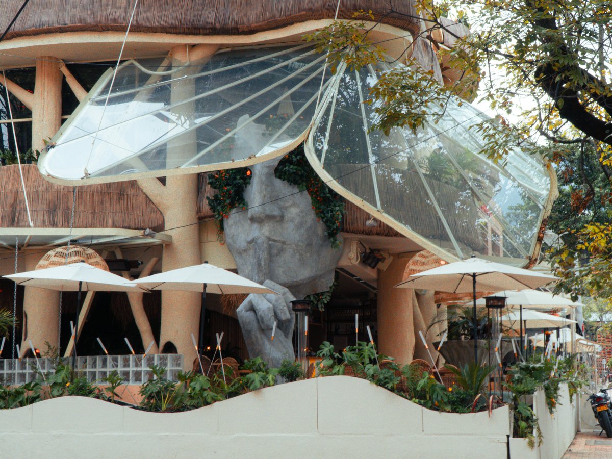 Unique mushroom-shaped building with outdoor seating