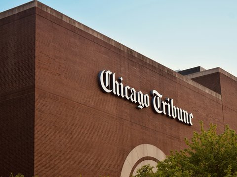a brick building with a sign on the side of it