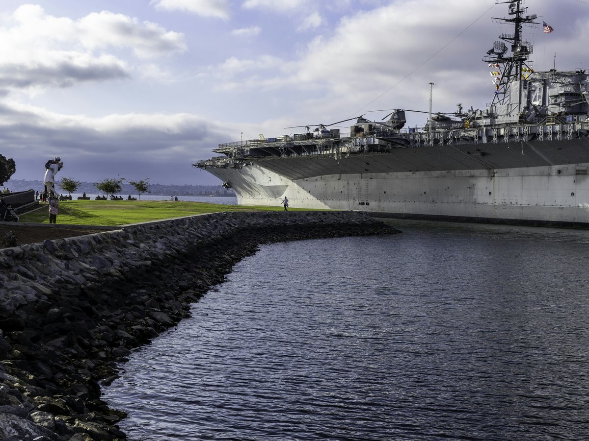 A large ship is docked in a harbor