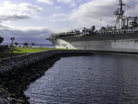 A large ship is docked in a harbor