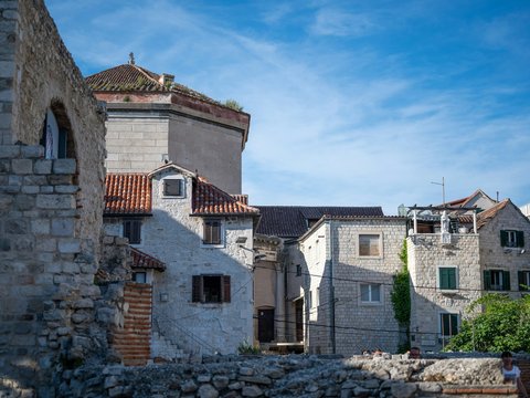 a stone building with a clock tower on top of it