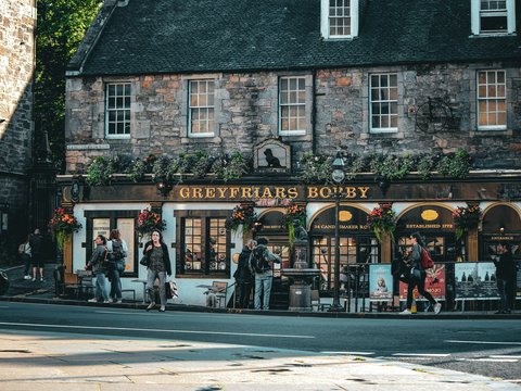 a group of people standing outside of a store
