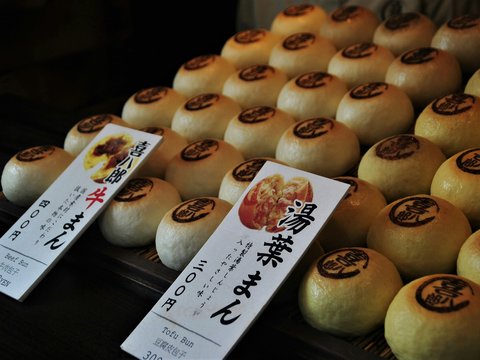 white and brown pastry on display counter
